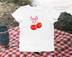 cherry with a bow coquette baby tee, pink cherry fitted tshirt, lana del rey inspired baby tee, christmas gifts for frie