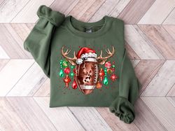 iconic christmas symbols football reindeer antlers santa hat and christmas ornaments sweatshirt, funny christmas sweatsh