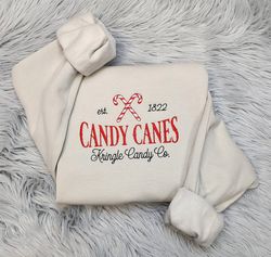 embroidered christmas candy canes sweatshirt, kringle candy company embroidered unisex crewneck