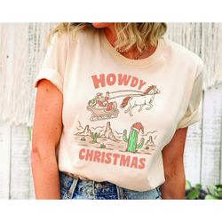 howdy christmas western shirt, retro christmas sweatshirt, santa sleigh western retro shirt, retro santa hat cactus and