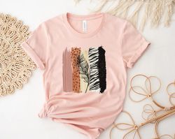 unique safari brush strokes with black feather, animal print design on premium, animal print tee