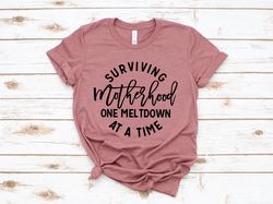 surviving motherhood one meltdown at a time shirt, funny mom shirt, wife shirt, mama shirt, mom life shirt, mothers day