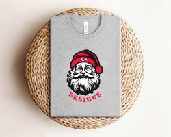 santa claus believe kansas city football team shirt