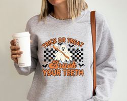 dental hygienist sweatshirt, spooky dental assistance sweater, trick or treat brush your teeth, halloween dentist hoodie