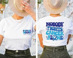 nobody fights cancer alone shirt, colon cancer awareness shirt, dark blue ribbon, cancer warrior shirt, family cancer su
