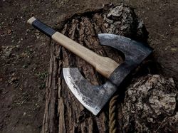 forged ax handmade. large forged double-headed axe. ax hand forged from hardened carbon steel. viking axe. leather sheat