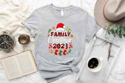 family christmas 2023 red hat gift shirt, funny christmas  stocking tshirt, christmas family vacation squad shirt mockup