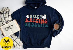 busy raising ballers hoodie, game day baseball hoodie, ballers hoodie, baseball match night hoodie, baseball ballers hoo