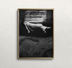 woman floating underwater, black and white art, vintage wall art, dark moody art, old photo