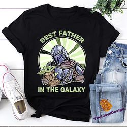 the mandalorian and baby yoda t-shirt, best father in the galaxy shirt, baby yoda unisex t-shirt, baby yoda vintage shir