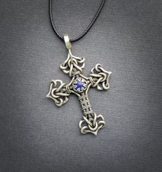 handcrafted wire wrap cross pendant with lapis lazuli