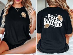 busy raising ballers shirt, game day shirt, trendy baseball shirt, trendy football shirt, football mom shirt, ball is li