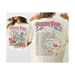 retro 2sided meet me at pixar pier shirt retro disney pixar characters group tshirt disneyland pixar fest 2024 tee, disn