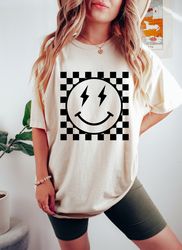 checkered pattern smiley face oversized vintage t-shirt, retro smiley face shirt, lightning smiley face shirt