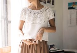 lace pullover top with a loose fit and a round yoke