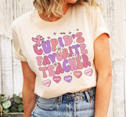 cupids favorite teacher shirt, groovy student valentines day tee, retro candy heart classroom shirt, trendy esl educator