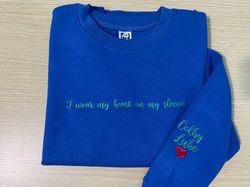 embroidered i wear my heart on my sleeve sweatshirt with kids names on sleeve, custom embroidery mom hoodie, new mom gif