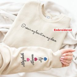 custom embroidered mom sweatshirt with kid names on sleeve, personalized mom sweatshirt, i wear my heart on my sleeve, m