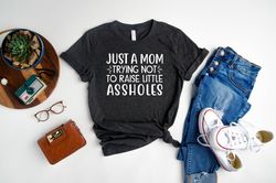 just a mom trying not to raise little assholes shirt, mothers day shirt, cute and simple tee, mom life shirt, new mom gi