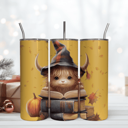 baby highland cow with a witch hat and with pumpkins reading book 20oz tumbler png