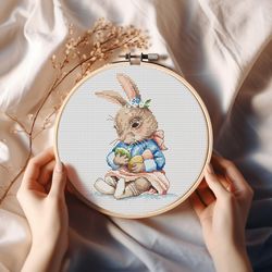 easter bunny girl with colorful eggs cross stitch pattern baby rabbit in dress embroidery chart easter baby bunny pdf