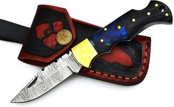 the damascus steel folding pocket knife design with precious rosewood handle and brass guard, unique and comfortable