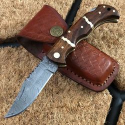 custom made damascus steel folding pocket knife with walnut and brass handle, leather sheath