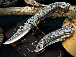 custom hand made d2 steel engraved folding knife..