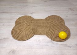 jute pet rug in the form of a bone mat under pet bowls pet mat