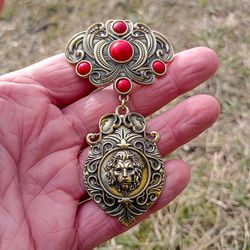 handmade brass dukach lion,brass lion necklace pendant,traditional ukrainian brass jewellery,ukrainian dukach with a bow