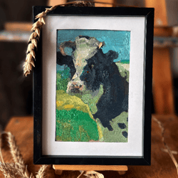small oil painting in a frame cow