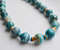 2 blue green gold white striped beaded necklace.jpg