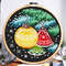 This is a cross stitch pattern with Christmas decorations on the Christmas tree.