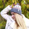 Knitted-jacquard-hat-with-a-pompom-5