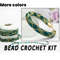 Beads strung on a thread according to the pattern for making your own emerald green bracelet