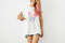 clothing-design-style-fashion-advertising-portrait-unrecognizable-slim-hipster-woman-with-pink-hair-highlights-tattooed-arms-smiling-pointing-finger-blank-t-shi