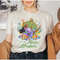 MR-15520239102-let-the-magic-blossom-disney-epcot-shirt-isabella-encanto-sand.jpg