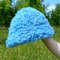 Cute bucket hat. Style curly hat. Bright blue fluffy fur panama hat.