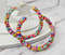 Colorful-beaded-hoop-earrings-multicolor-seed-bead-jewelry-big-hoops-native-american-beadwork-jewelry-handmade-statement-earrings.jpeg