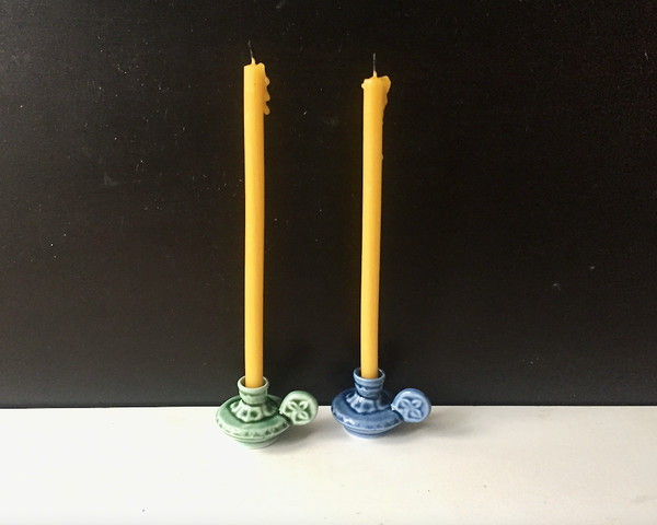 Small ceramic candlestick holders with a handle