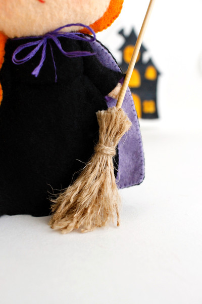 Felt witch broomstick close-up view