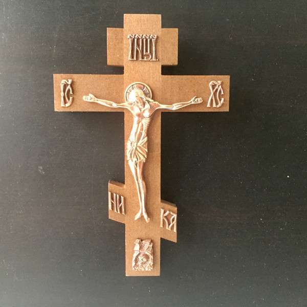 Wooden wall cross with copper crucifix