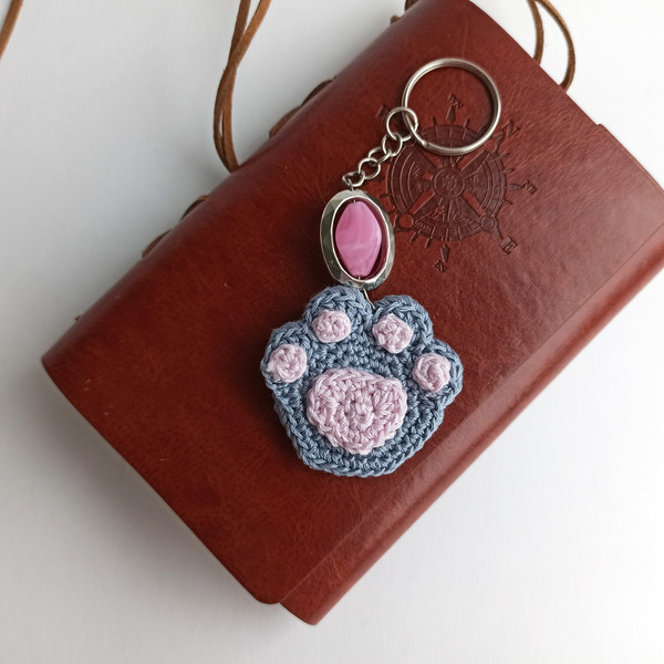 Crochet_Cat_Paw_on_a_Brown_Notebook_with_a_Pink_Keychain_8.jpg