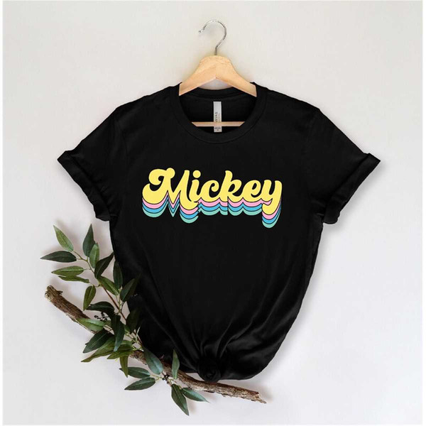 MR-95202322032-there-is-a-cotton-or-cotton-polyester-mix-shirts-these-shirts-have-disney-designs-the-colors-are-navy-black-heather-olive-and-red.jpg