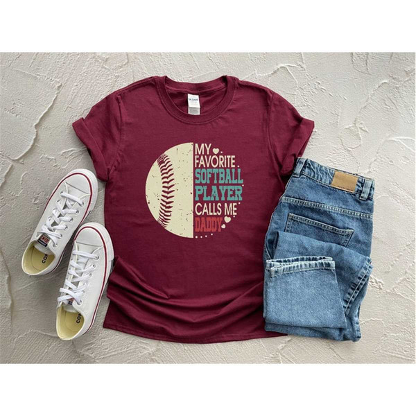 MR-1152023171319-there-is-a-cotton-or-cotton-polyester-mix-shirts-these-shirts-have-softball-designs-the-colors-are-heather-maroon-heather-navyblack-and-revize.