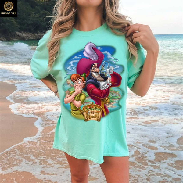 https://www.inspireuplift.com/resizer/?image=https://cdn.inspireuplift.com/uploads/images/seller_products/1683944986_MR-135202392935-vintage-peter-pan-vs-captain-hook-shirt-vintage-disney-image-1.jpg&width=600&height=600&quality=90&format=auto&fit=pad