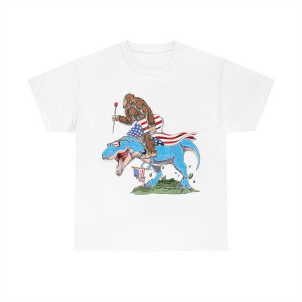 MR-1852023111121-bigfoot-riding-dinosaur-usa-flag-4th-of-july-america-t-shirt-image-1.jpg
