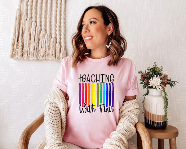 https://www.inspireuplift.com/resizer/?image=https://cdn.inspireuplift.com/uploads/images/seller_products/1688134541_TeachingWithFlairFlairPensTeacherShirtTeacherTeeTeachShirtTeacherT-ShirtsTeacherGiftFunnyTeacherShirtsFlairPenTee-6.jpg&width=600&height=600&quality=90&format=auto&fit=pad