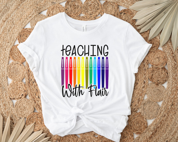 https://www.inspireuplift.com/resizer/?image=https://cdn.inspireuplift.com/uploads/images/seller_products/1688148892_TeachingWithFlairFlairPensTeacherShirtTeacherTeeTeachShirtTeacherT-ShirtsTeacherGiftFunnyTeacherShirtsFlairPenTee-3.jpg&width=600&height=600&quality=90&format=auto&fit=pad