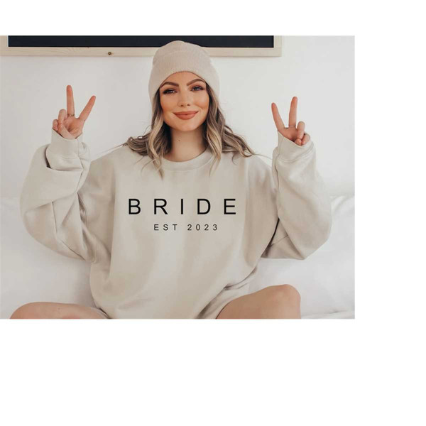 MR-23102023141342-bride-apparel-cute-and-comfy-sweatshirt-bride-est-2023-image-1.jpg